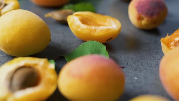 Nice Yummy Fresh Sliced Apricots Green Tree Leaves Dark Texture — Stock Video
