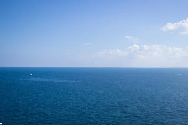 Calm sea, blue water, sky and horizon scene in Tunisia. Vacation holidays relaxing concept.