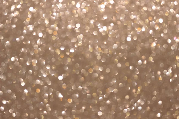 An abstract silver background with sparkle lights and bokeh. Useful as Christmas background or greeting card.