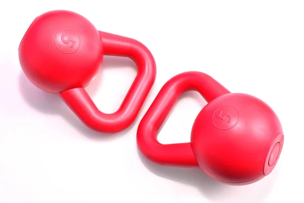 Couple red kettle bell on white background
