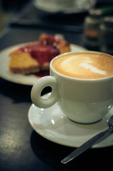 Cup of coffee with cake