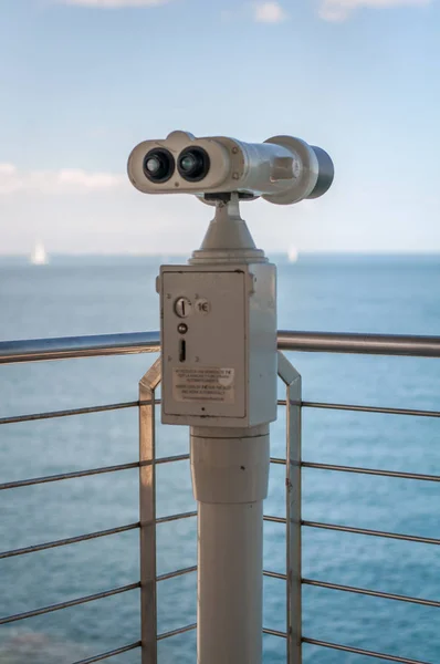 public binoculars to observe the sea