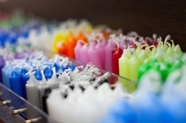 colored wax candles in the store