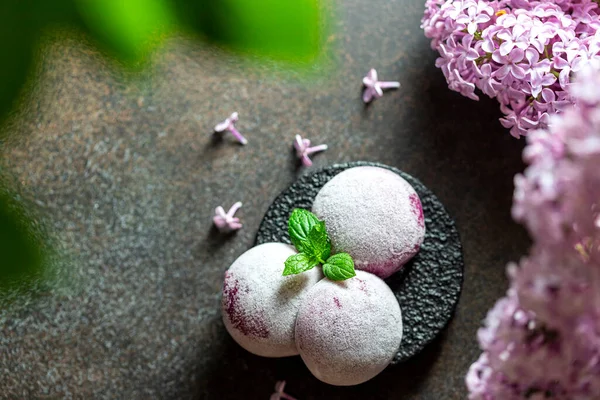 Homemade Purple Ube Ice Cream. Japanese Moti ice cream in rice dough. Traditional japanese dessert on a white background. Selective focus, copy space