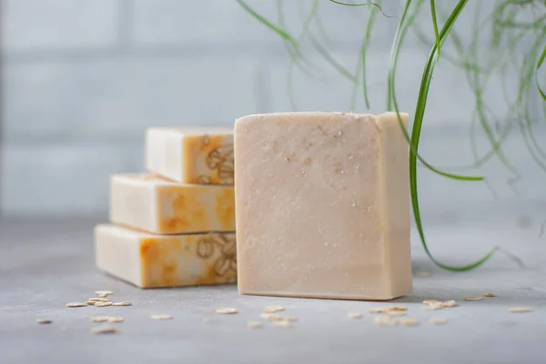 Handmade soap bars with oatmeal flakes. Organic soap making. Spa treatments. Selective focus
