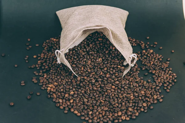 Retro fabric bag with coffee beans on the table