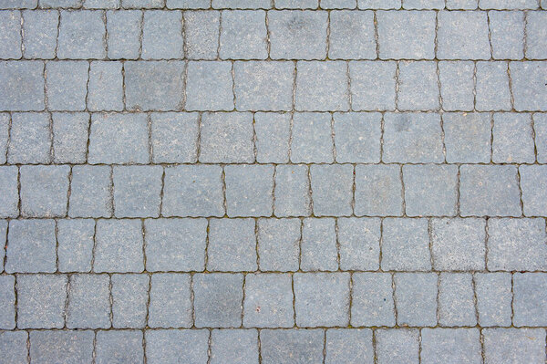 Simple texture of gray street paving slabs