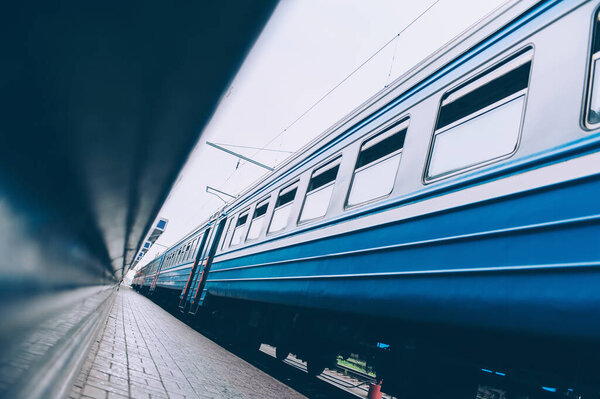 Passenger train on the platform of the railway station