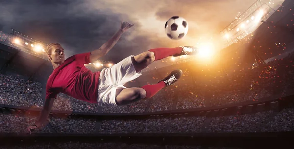 Soccer player in action on stadium background.The imaginary soccer stadium is modelled and rendered.