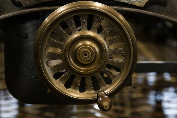 Wheel on and old spinning machine