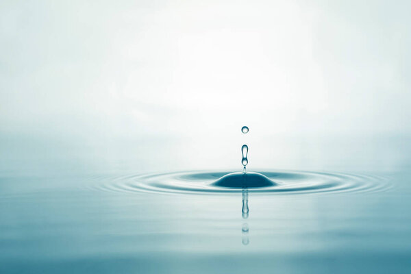 Water droplets on surface water background
