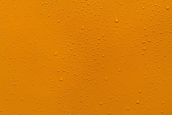 Nahaufnahme Wassertropfen Orange Hintergrund — Stockfoto