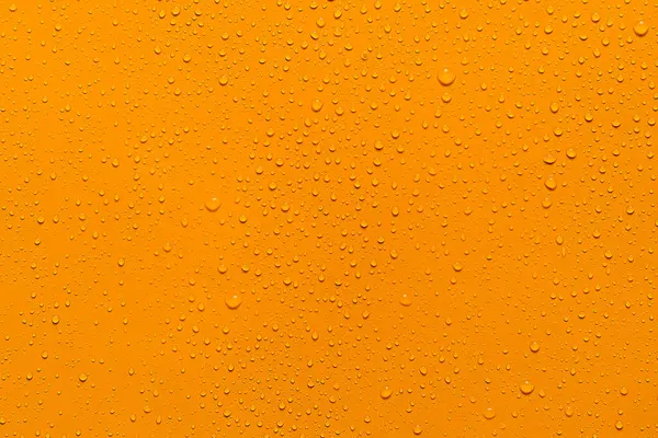 Nahaufnahme Wassertropfen Orange Hintergrund — Stockfoto