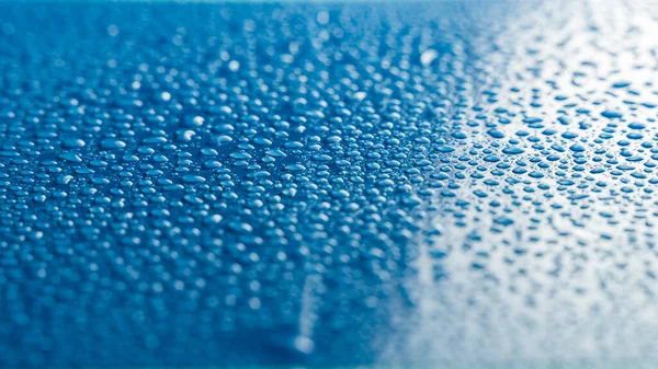 Close Depth Field Water Drops Blue Background — Stock Photo, Image