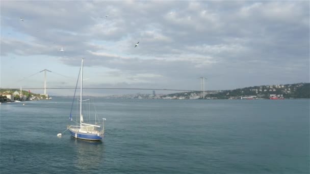 Aerial view of Sailboat and Istanbul Bosphorus Bridge — Stock Video