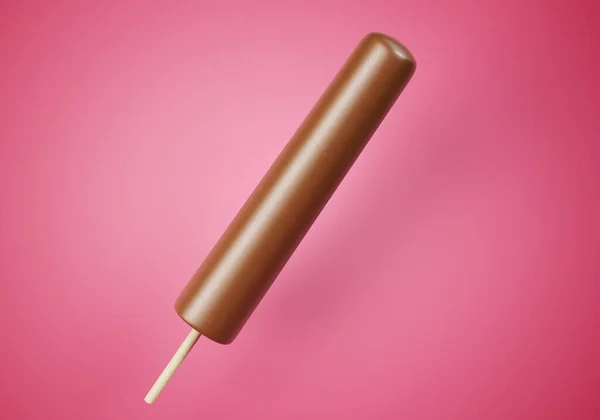 Bruine Chocolade Ijslolly Een Kleurrijke Roze Achtergrond Verfrissende Zomer Zoet — Stockfoto