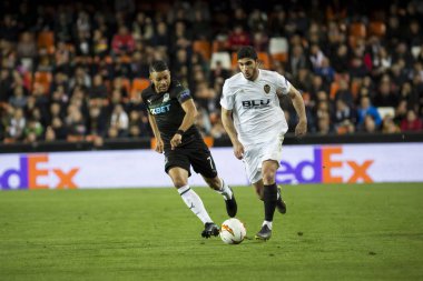 Valencia, İspanya - 7 Mart: Uefa Avrupa Ligi sırasında topuyla Guedes arasında Valencia Cf ve Fc Krasnodar Mestalla Stadı nda 7 Mart 2019 Valencia, İspanya eşleme