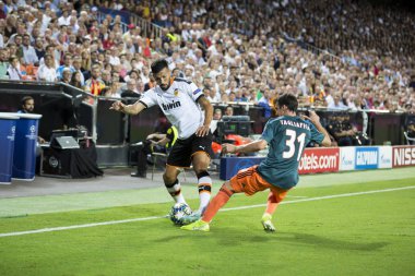 VALENCIA, SPAIN - OCTOBER 02, 2019: Garay with ball during UEFA Champions League match between Valencia CF and AFC Ajax at Mestalla Stadium  clipart