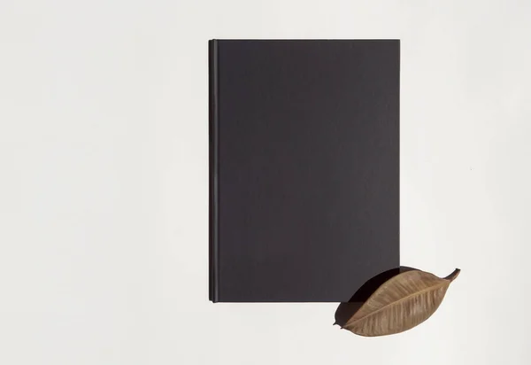 Black Folder Menu Brown Leaf White Background — Stock Photo, Image