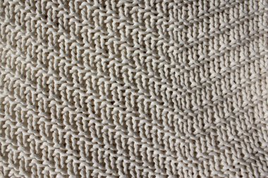 Doku beyazı arka plan. Örülmüş yün dokusu.