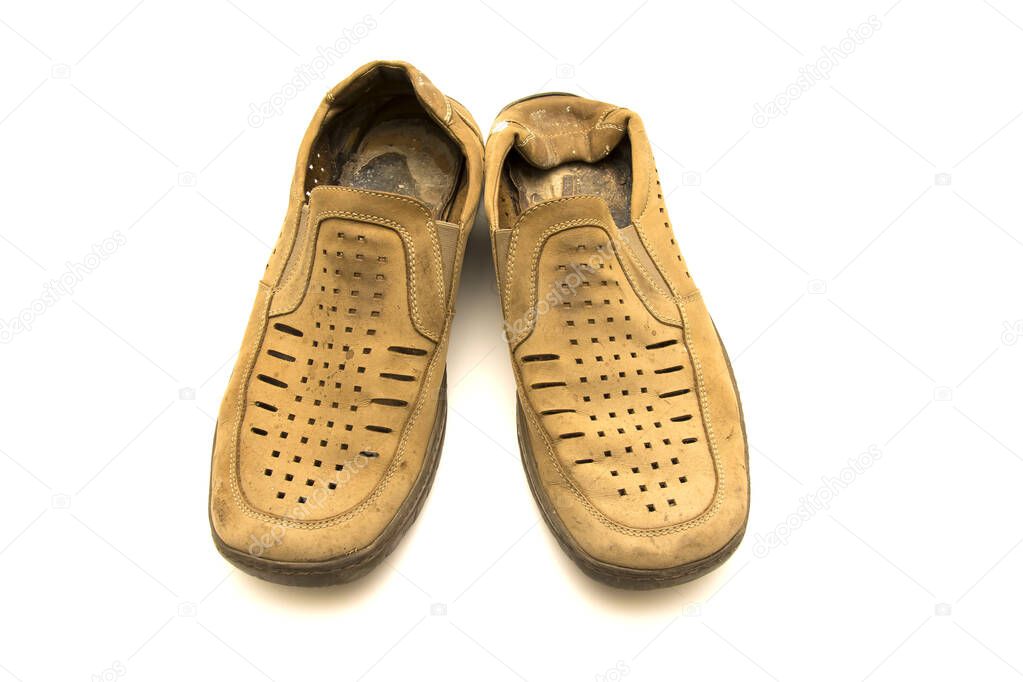 very old men's shoes on a white background