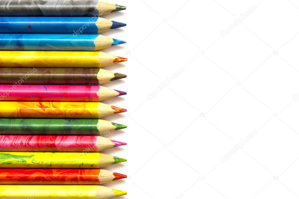 many color pencils on a white background copy space