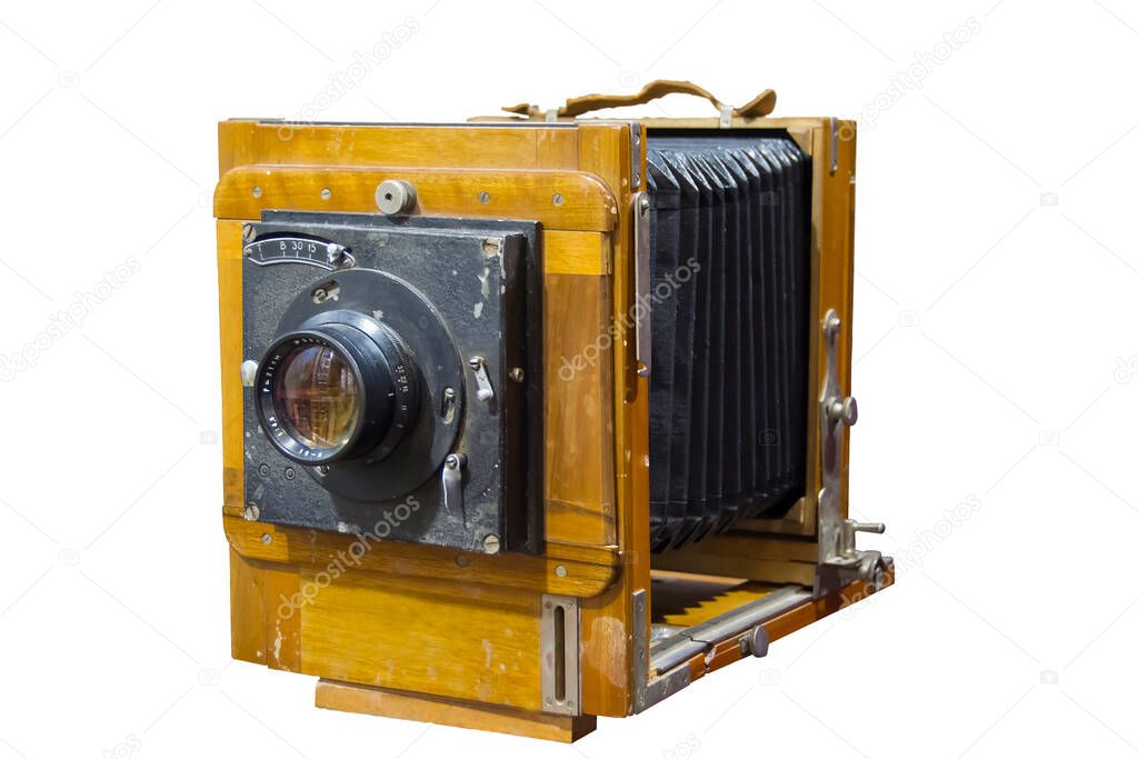 very old, shabby and scratched camera on a white background