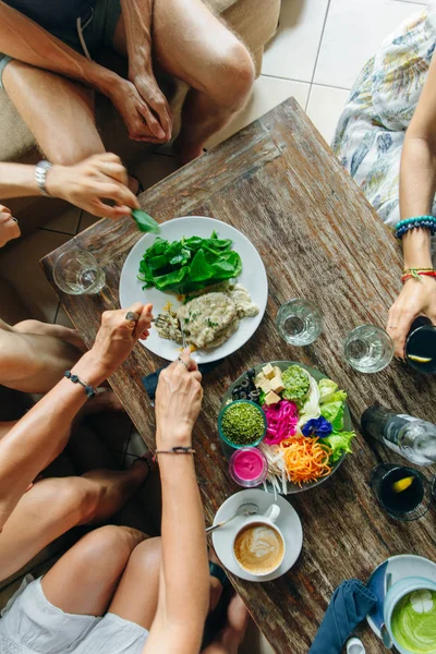 friends eat at a vegan restaurant