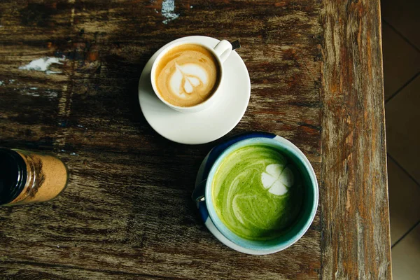 green vegan cream soup and cup of coffe