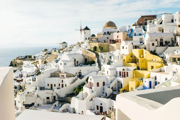 view of picturesque village of Oia with traditional white archit