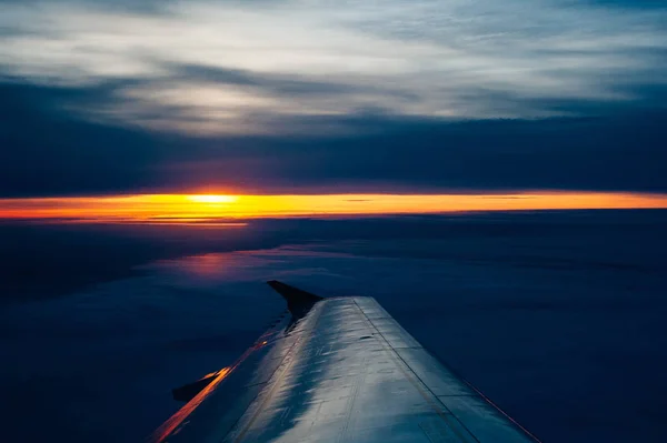 The colorful sunset from an airplane view — Stock Photo, Image