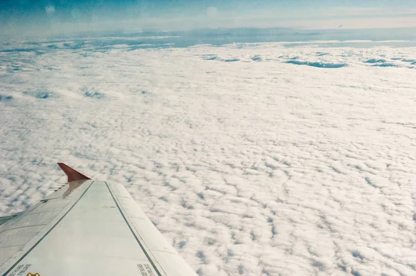 Aerial view of cloud and sky with airplane wing,Traveling concept. — Stock Photo, Image