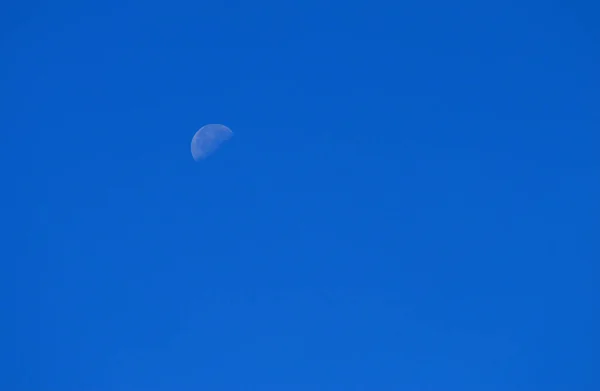 cresent moon on a blue sky visible during the day. Since a  moon is symbolic of culmination, completion, and fruition, a blue moon in Libra will be one impressing our inner worlds with balance, beauty, and grace, perhaps prompting us to take on more