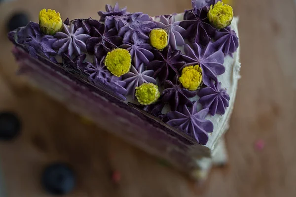 Purple Cake with Lemon Buttercream is cut into mini individual cakes, decorated with fresh blackberries, for a beautiful and tasty dessert.