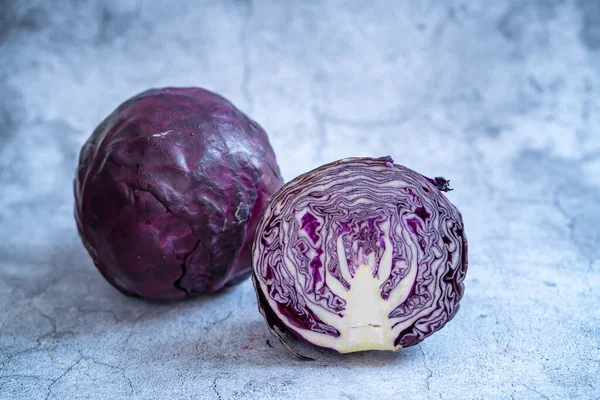 Purple cabbage, collard Purple, Chinese cabbage, white cabbage, cabbages and cut cabbage on mable stone.