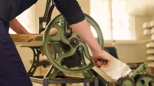 Creation of puff pastry manually in an Italian artisan pasta factory.