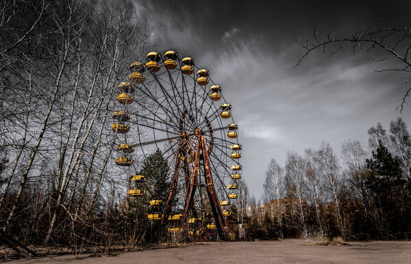 Old ferris wheel in the ghost town of Pripyat. Consequences of the accident at the Chernobil nuclear power plant