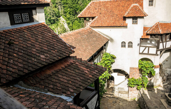 Bran, Transylvania region, Romania - June 10, 2018: medieval castle Bran in the Carpathian Mountains, Transylvania. The legendary residence of Count Dracula, Vlad Tepes. Tourist, historical and cultural landmark of Romania