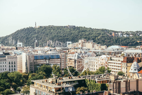 Budapest, Hungary - August 29, 2019: Beautiful view of the historic quarter of Budapest, Hungary. Ancient houses and old narrow medieval streets and alleys. Summer tourist trip to the capital of Hungary