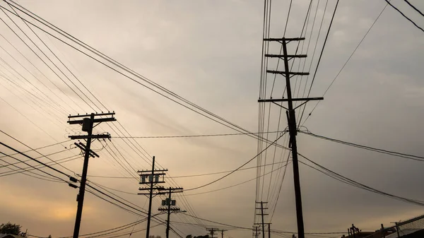 electric power lines at sunset time
