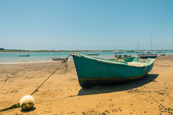 boat in the marshes waiting for the tide