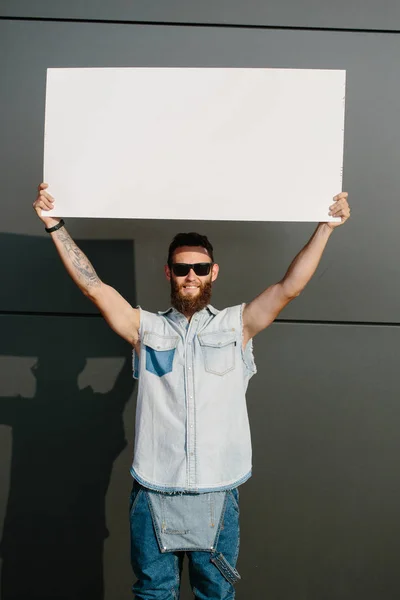 Hipster Man Holding Poster — Stock Photo, Image