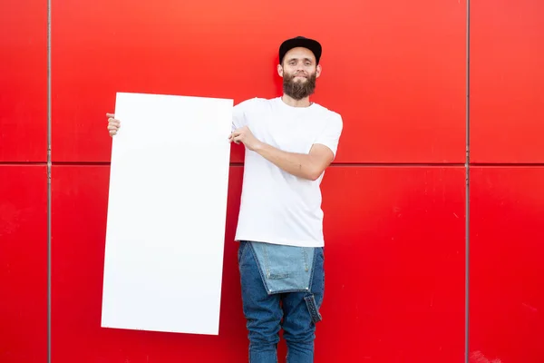 Hipster Homem Segurando Pôster — Fotografia de Stock