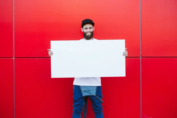 Hipster Homem Segurando Pôster — Fotografia de Stock