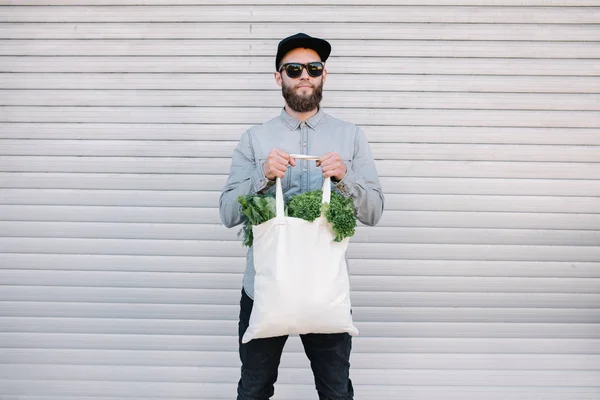 White eco cotton bag filled with grocery for mock up or your logo