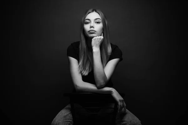 Fashion portrait of a sexy blonde woman with a make up wearing black clothes — Stock Photo, Image