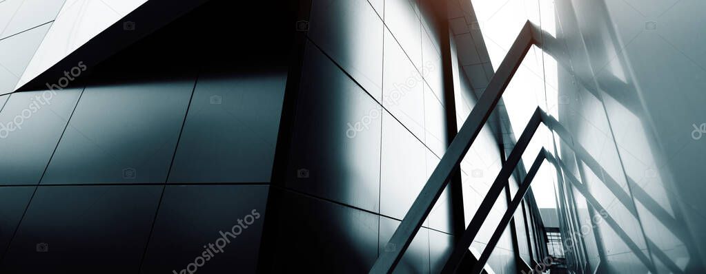 Wide angle abstract background view of steel light blue high rise commercial building skyscraper made of glass exterior. Website header or banner