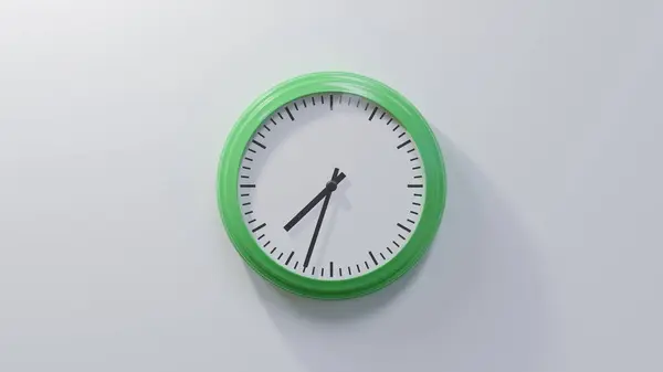 Glossy Green Clock White Wall Thirty Three Seven Time — Stock Photo, Image