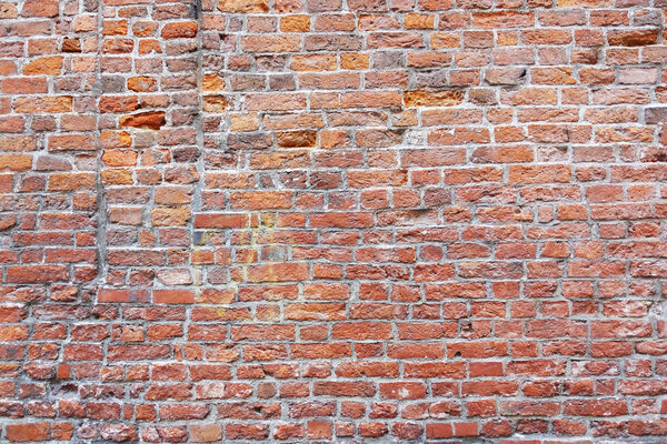 Old texture of brown brick wall as background