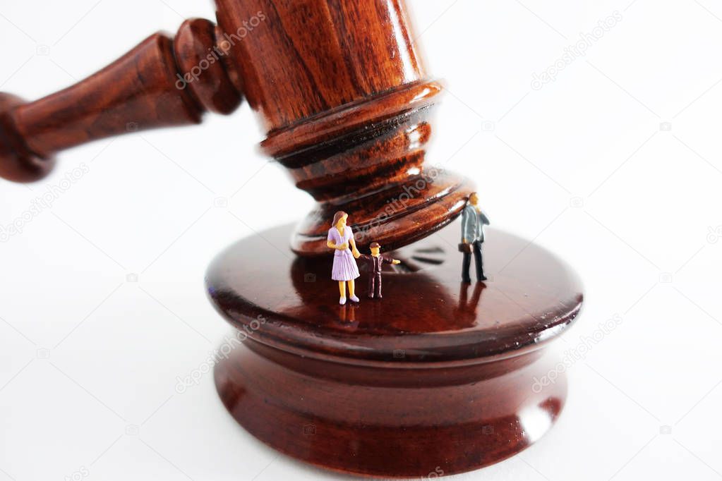                                Divorce and child custody concept with family figurine on wooden judge gavel